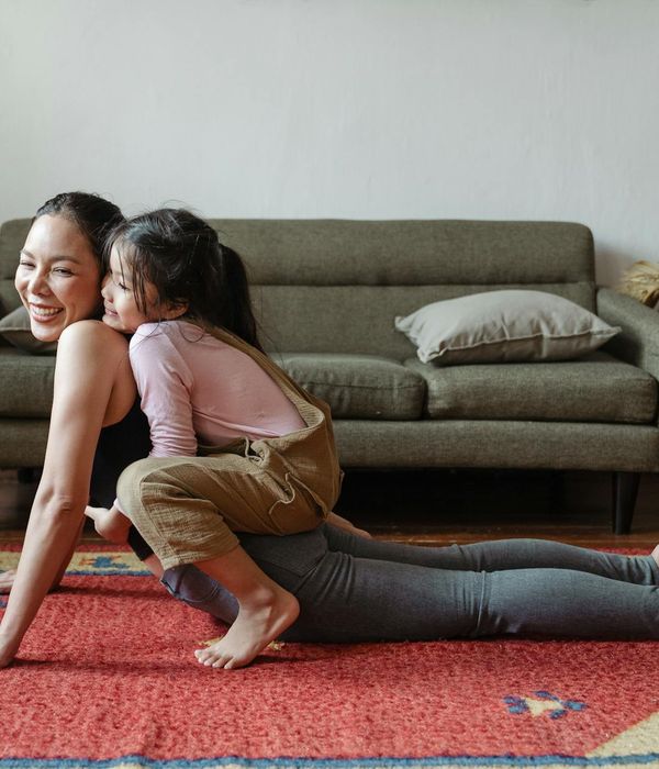 Woman in a calm yoga pose, embodying harmony and flexibility.